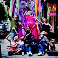 Staff of the Lower East Side Girls' Club pose in front of 'Girlzilla' who just may make an appearance at the New Ideas Festival street fair.